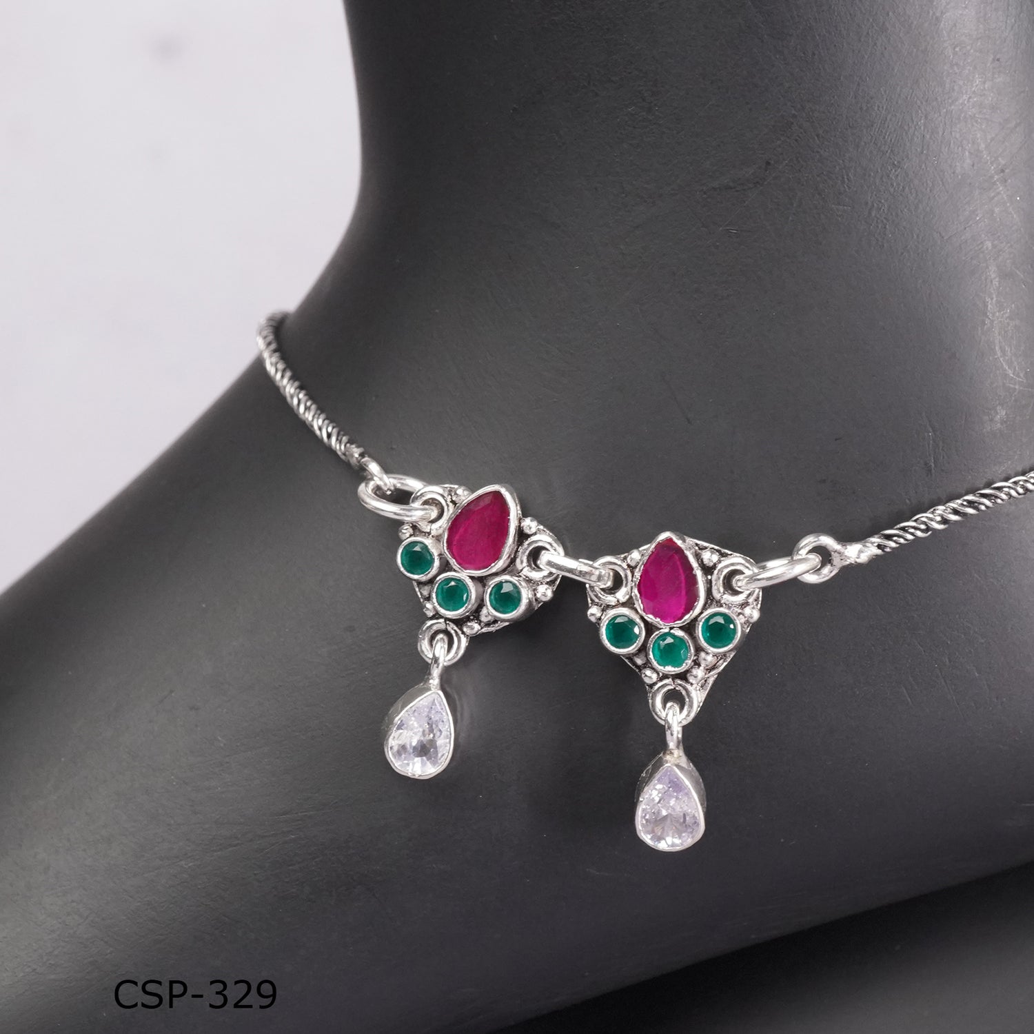 a close look of silver anklet design