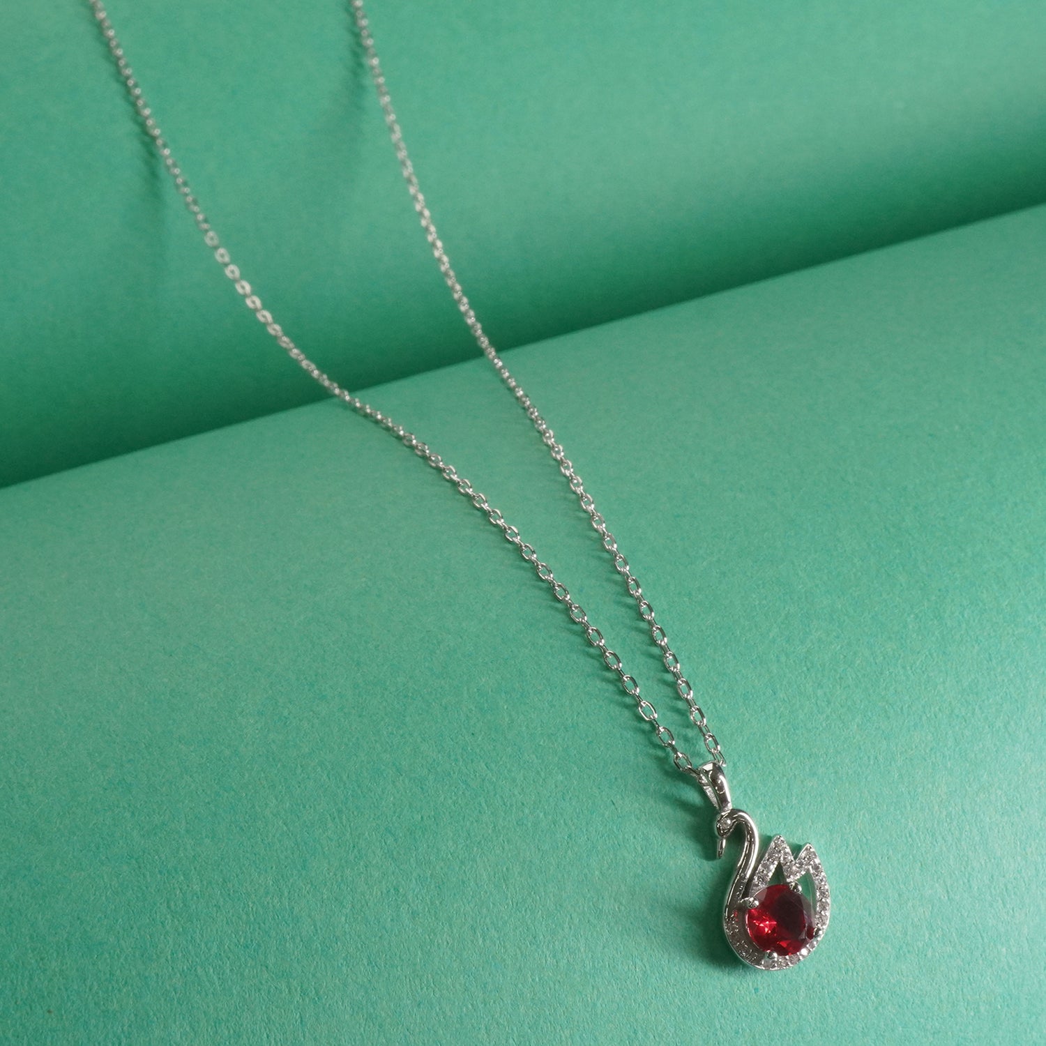 925 sterling silver chain necklace design with red stone peacock pendant . 