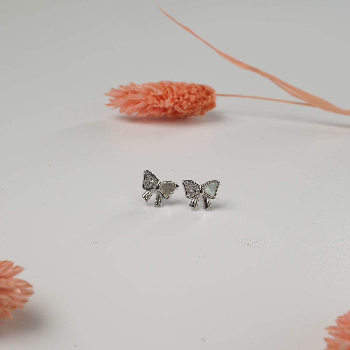 Daily wear silver earrings for women bow tie
