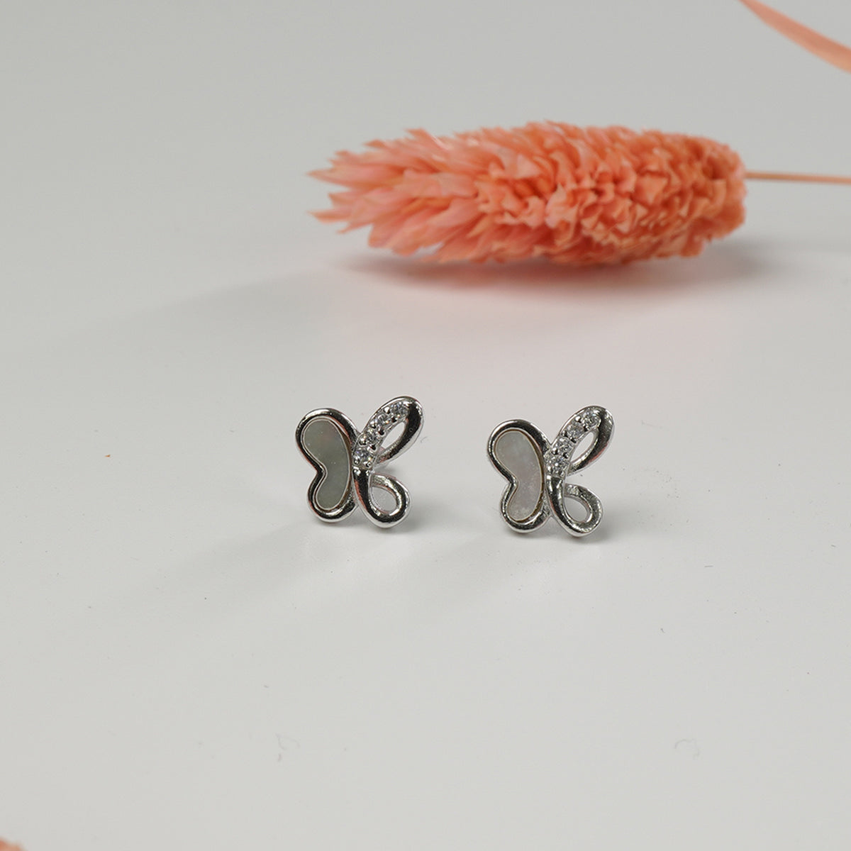 Minimal silver earrings for daily wear detail
