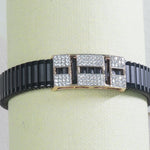 close up of square stone on silver band bracelet