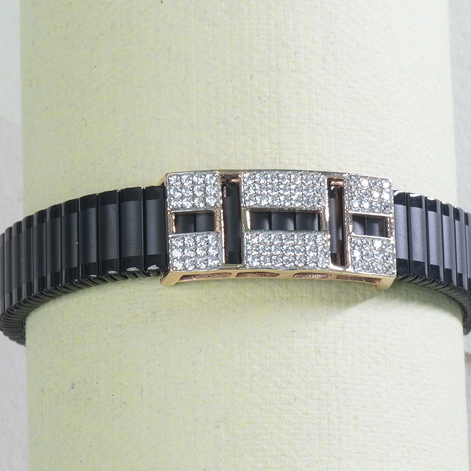 close up of square stone on silver band bracelet